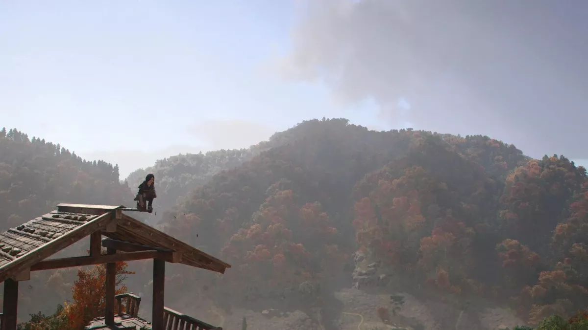 Naoe perches atop a watchtower in Assassin's Creed Shadows